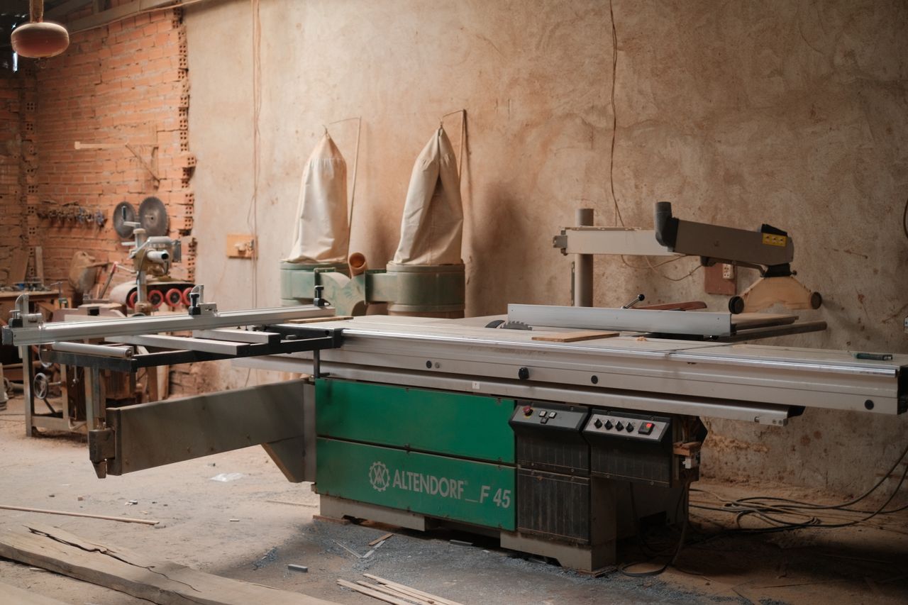services-03 Cozy woodworking workshop featuring a professional Altendorf F45 sliding table saw.